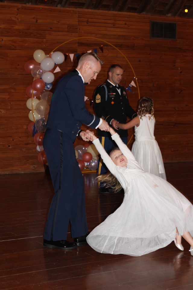 The Oklahoma Army National Guard held their Daddy/Daughter Dance on February the 11th, 2023.  The event was held at the Express Clydesdales Arena in Yukon, OK. Dads and daughters enjoyed dancing and spending time together.  Raising Canes Chicken was served for dinner and cookies, cakes and Valentines goodies were served. Dads and daughters also had the opportunity to have a picture made with one of the very large horses. The event was sponsored by VFW Post 8706 and Auxiliary, the El Reno Post Auxiliary and VFW District 10.Shout out to Darren Nichols with Raising Canes Chicken for their Assistance and discounts.