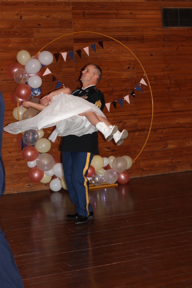 The Oklahoma Army National Guard held their Daddy/Daughter Dance on February the 11th, 2023.  The event was held at the Express Clydesdales Arena in Yukon, OK. Dads and daughters enjoyed dancing and spending time together.  Raising Canes Chicken was served for dinner and cookies, cakes and Valentines goodies were served. Dads and daughters also had the opportunity to have a picture made with one of the very large horses. The event was sponsored by VFW Post 8706 and Auxiliary, the El Reno Post Auxiliary and VFW District 10.Shout out to Darren Nichols with Raising Canes Chicken for their Assistance and discounts.